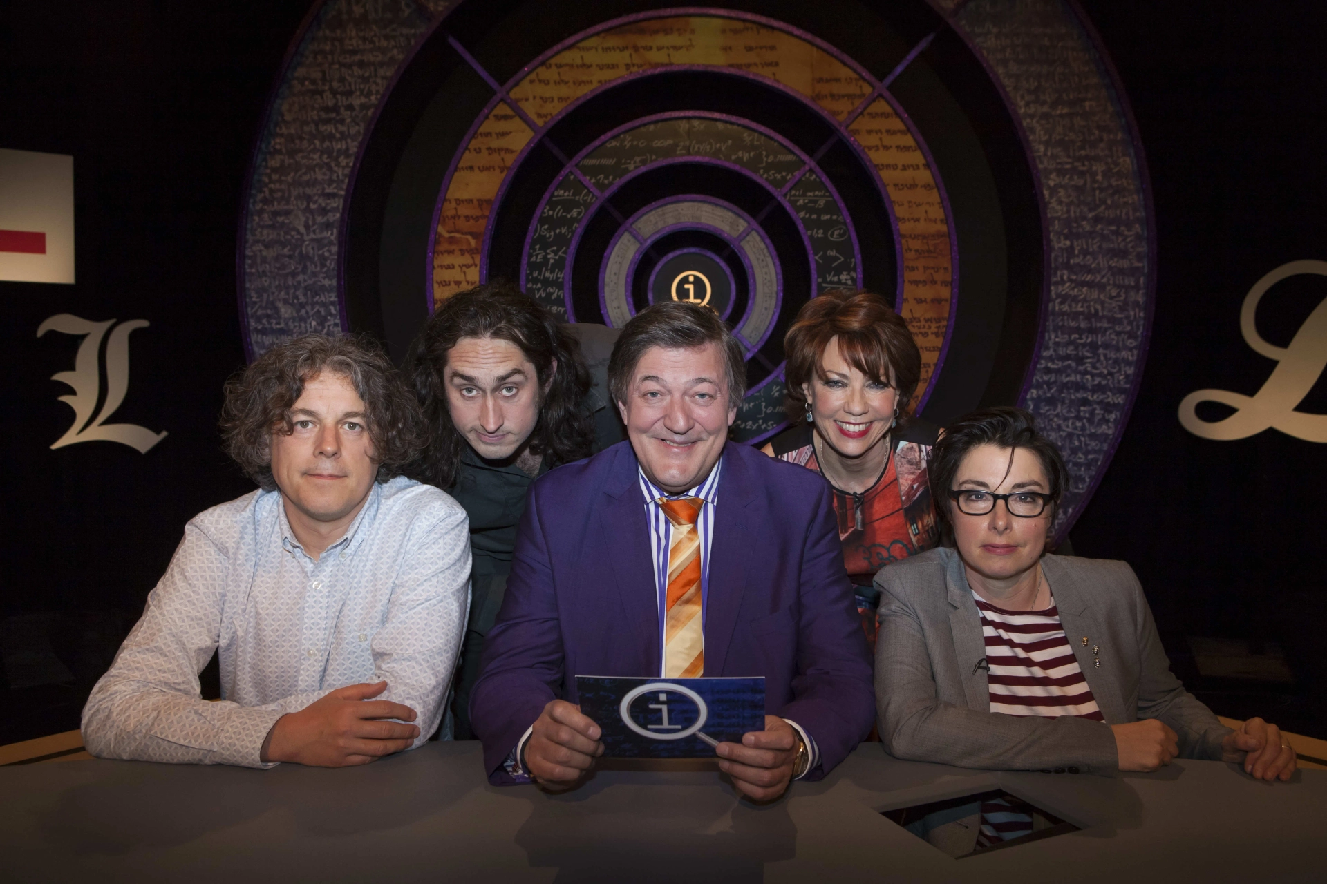 Stephen Fry, Alan Davies, Kathy Lette, Ross Noble, and Sue Perkins in QI (2003)