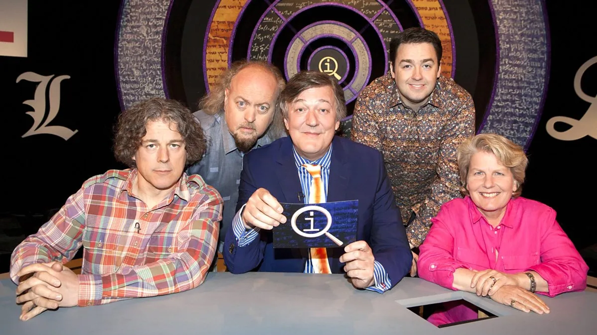 Stephen Fry, Bill Bailey, Alan Davies, Sandi Toksvig, and Jason Manford in QI (2003)