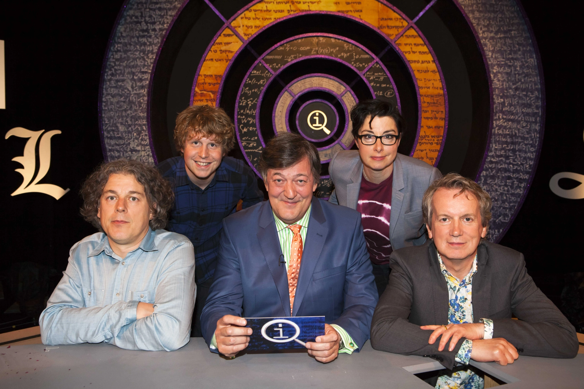 Stephen Fry, Alan Davies, Sue Perkins, Frank Skinner, and Josh Widdicombe in QI (2003)