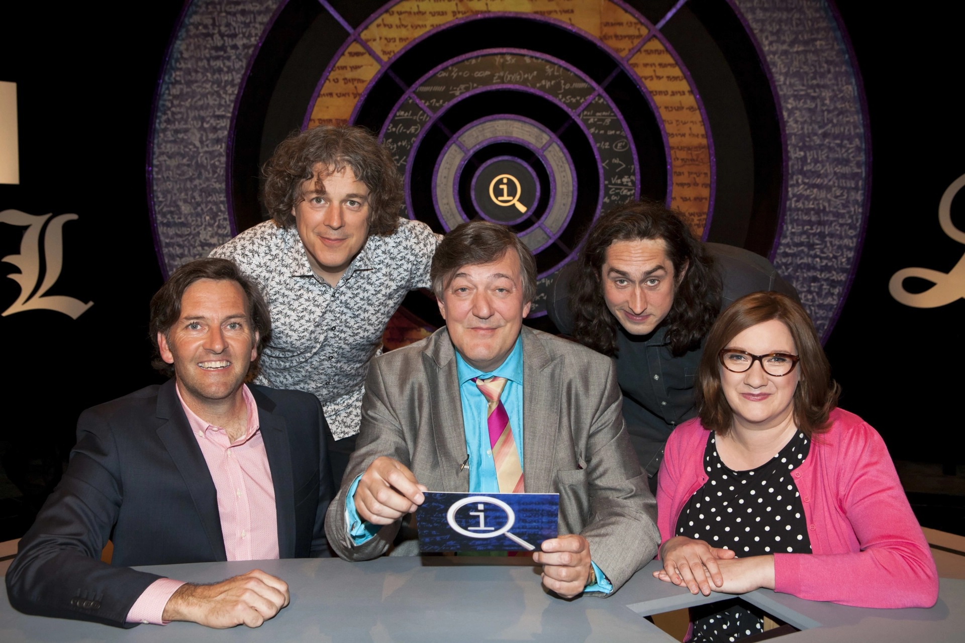 Stephen Fry, Alan Davies, Colin Lane, Ross Noble, and Sarah Millican in QI (2003)