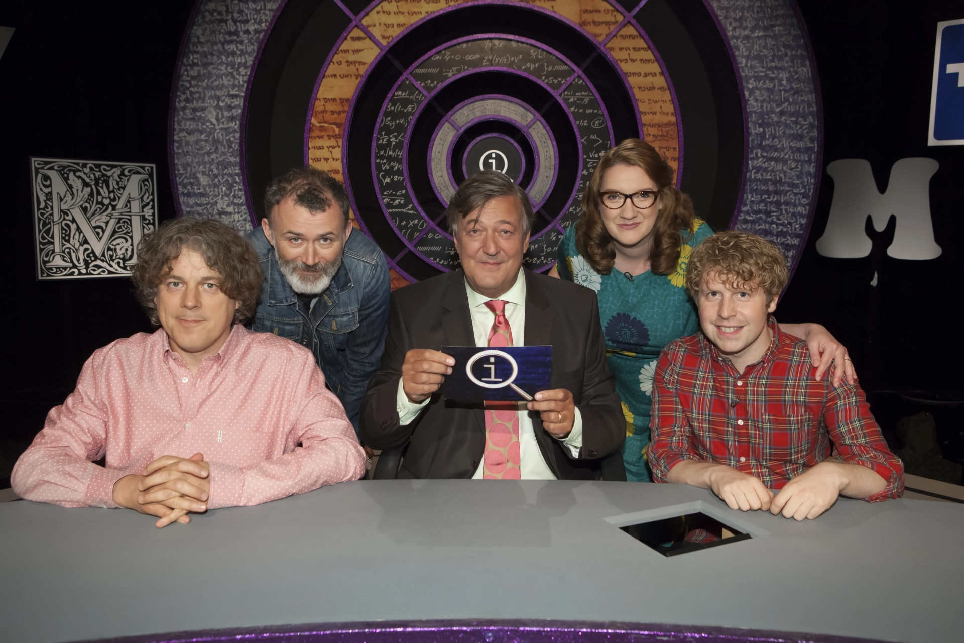 Stephen Fry, Alan Davies, Tommy Tiernan, Sarah Millican, and Josh Widdicombe in QI (2003)