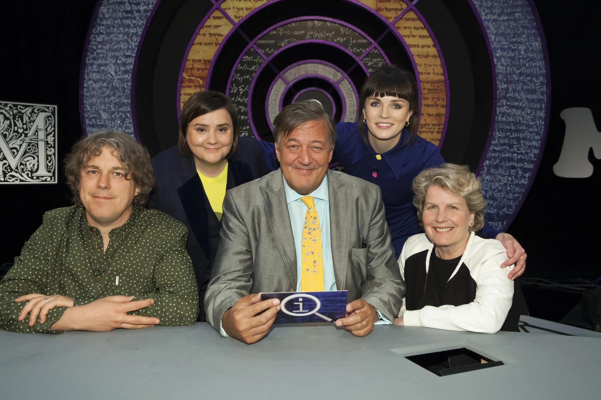 Stephen Fry, Alan Davies, Sandi Toksvig, Susan Calman, and Aisling Bea in QI (2003)