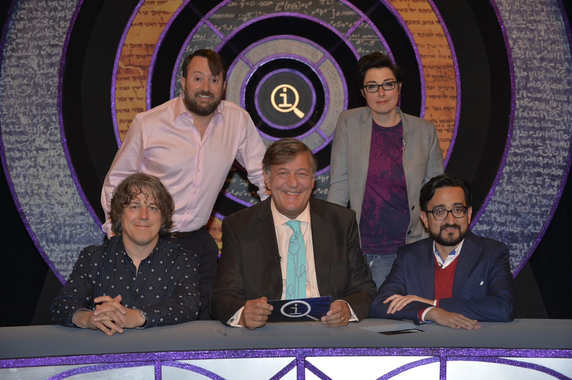 Stephen Fry, Alan Davies, David Mitchell, Sue Perkins, and Sami Shah in QI (2003)