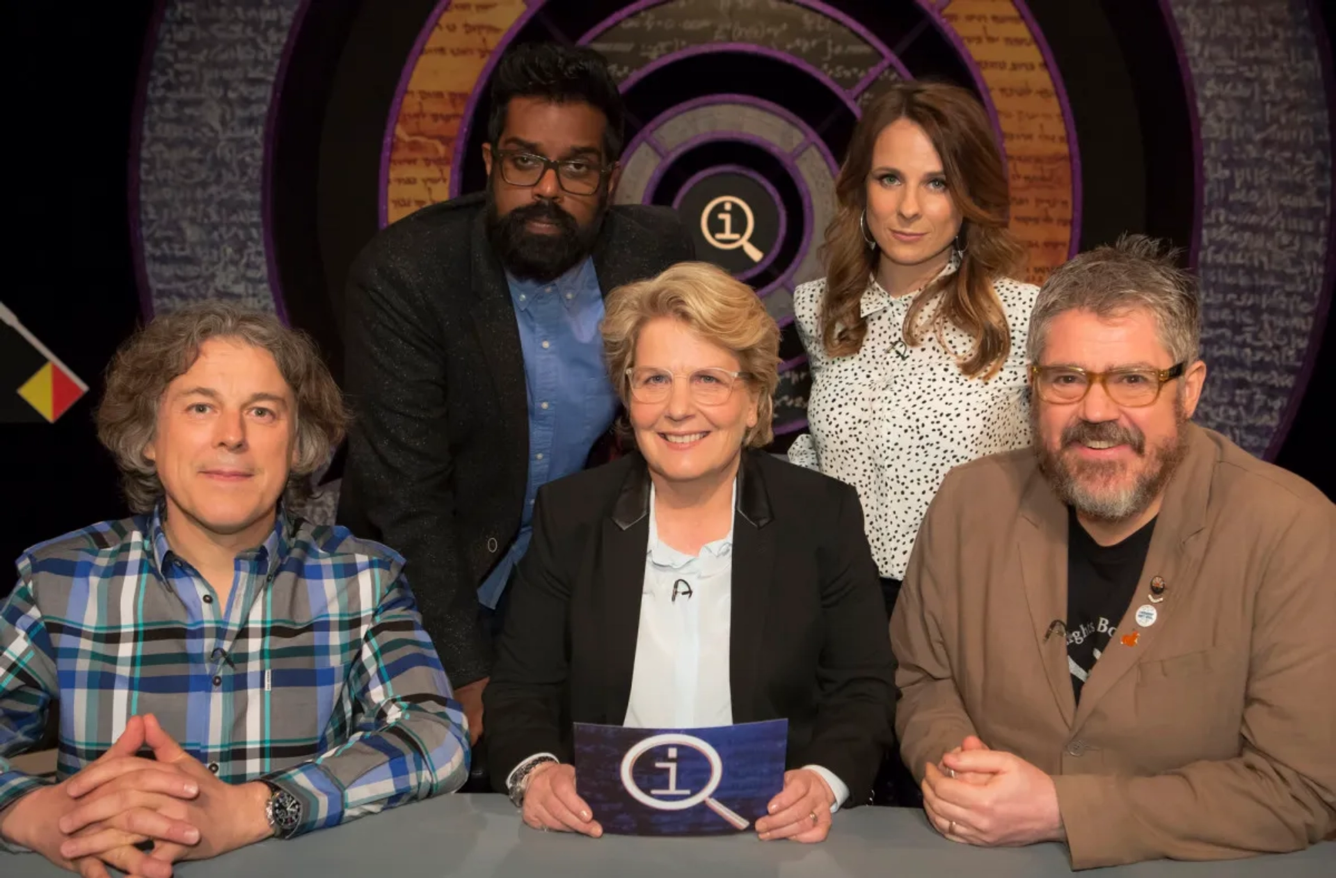 Alan Davies, Phill Jupitus, Sandi Toksvig, Cariad Lloyd, and Romesh Ranganathan in QI (2003)