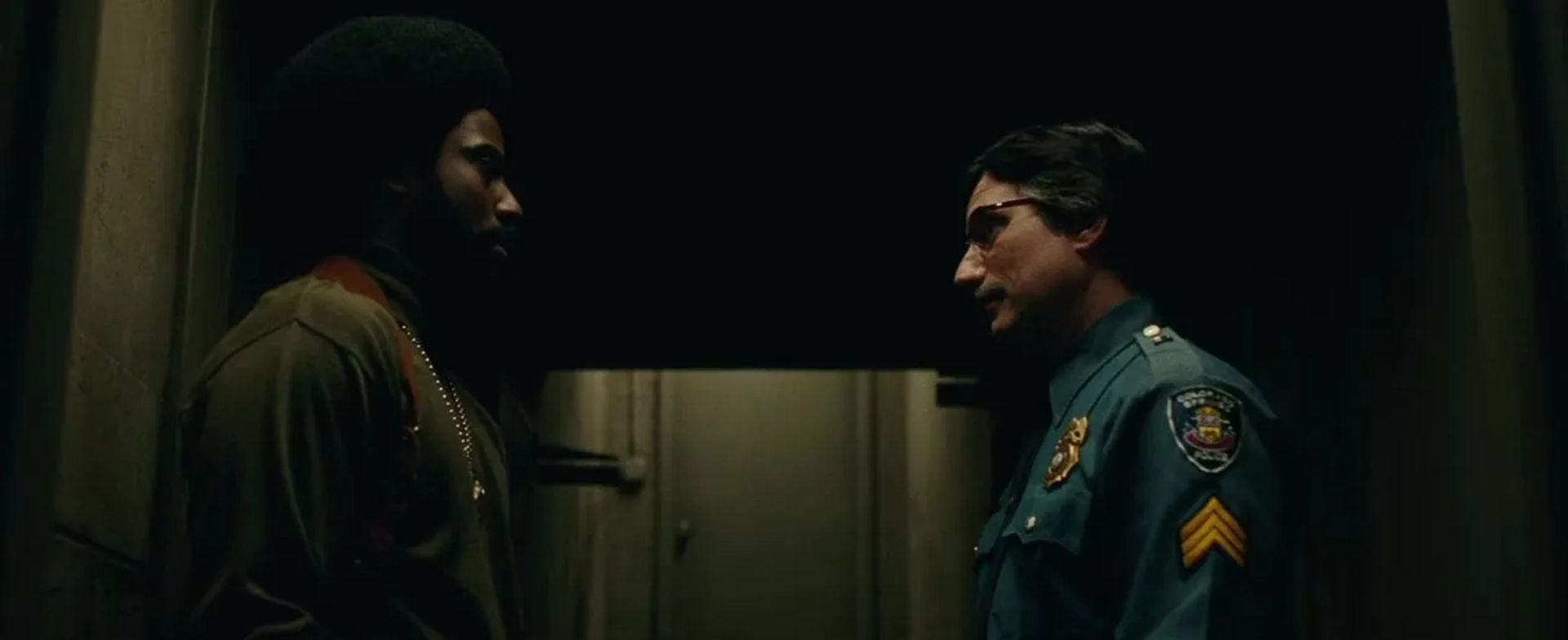 Ken Garito and John David Washington in BlacKkKlansman (2018)