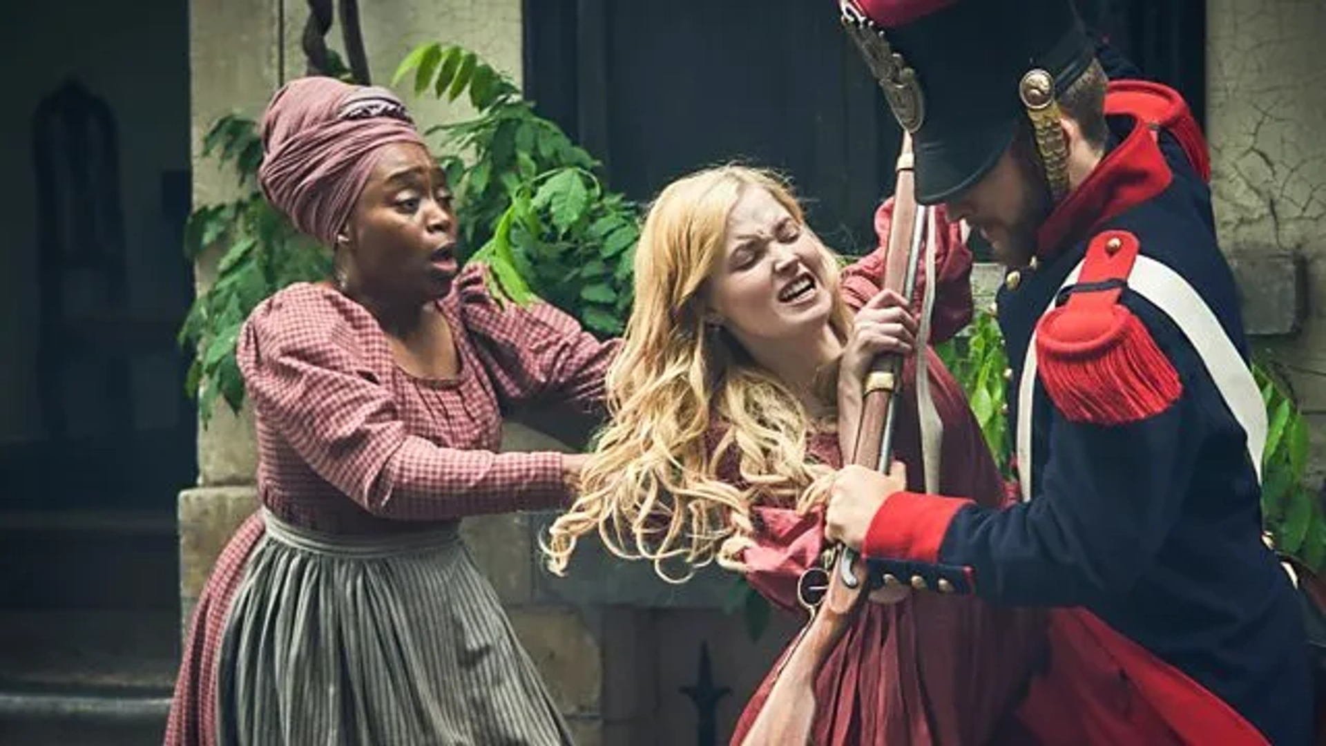 Angela Wynter and Ellie Bamber in Les Misérables (2018)