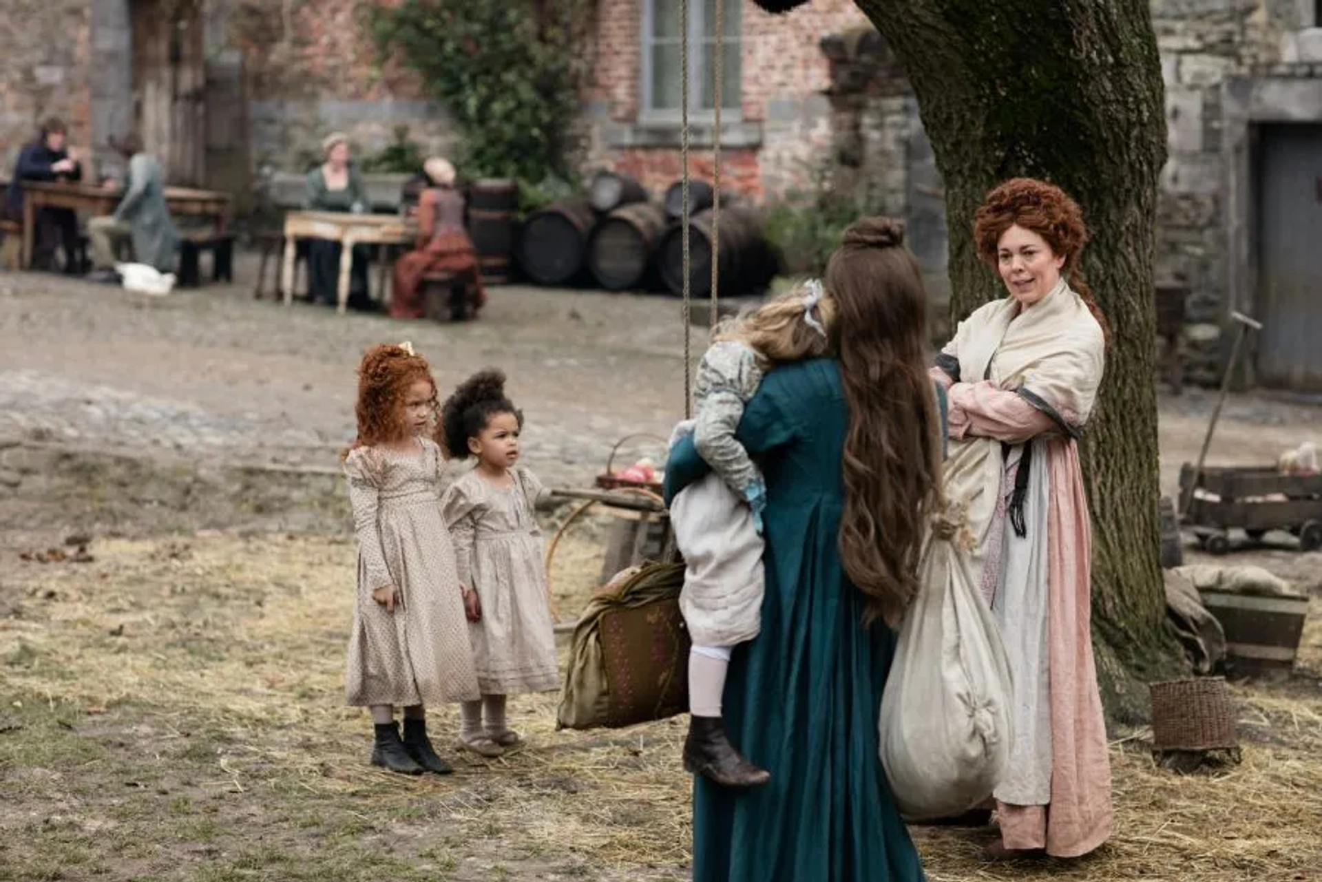 Mailow Defoy, Sienna Barnes, Amani Johnson, Olivia Colman, and Lily Collins in Les Misérables (2018)