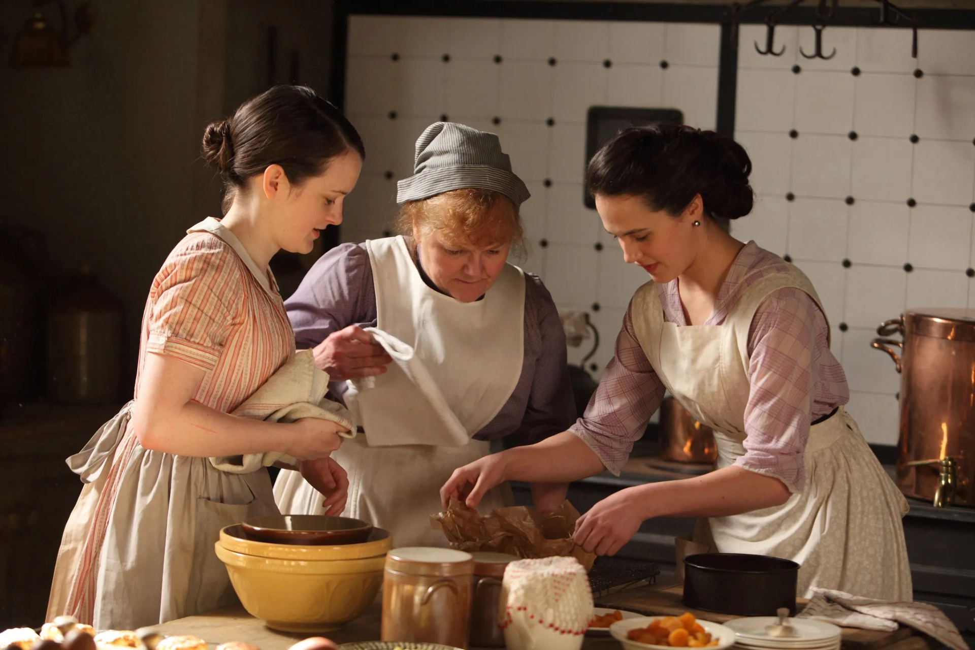 Lesley Nicol, Sophie McShera, and Jessica Brown Findlay in Downton Abbey (2010)