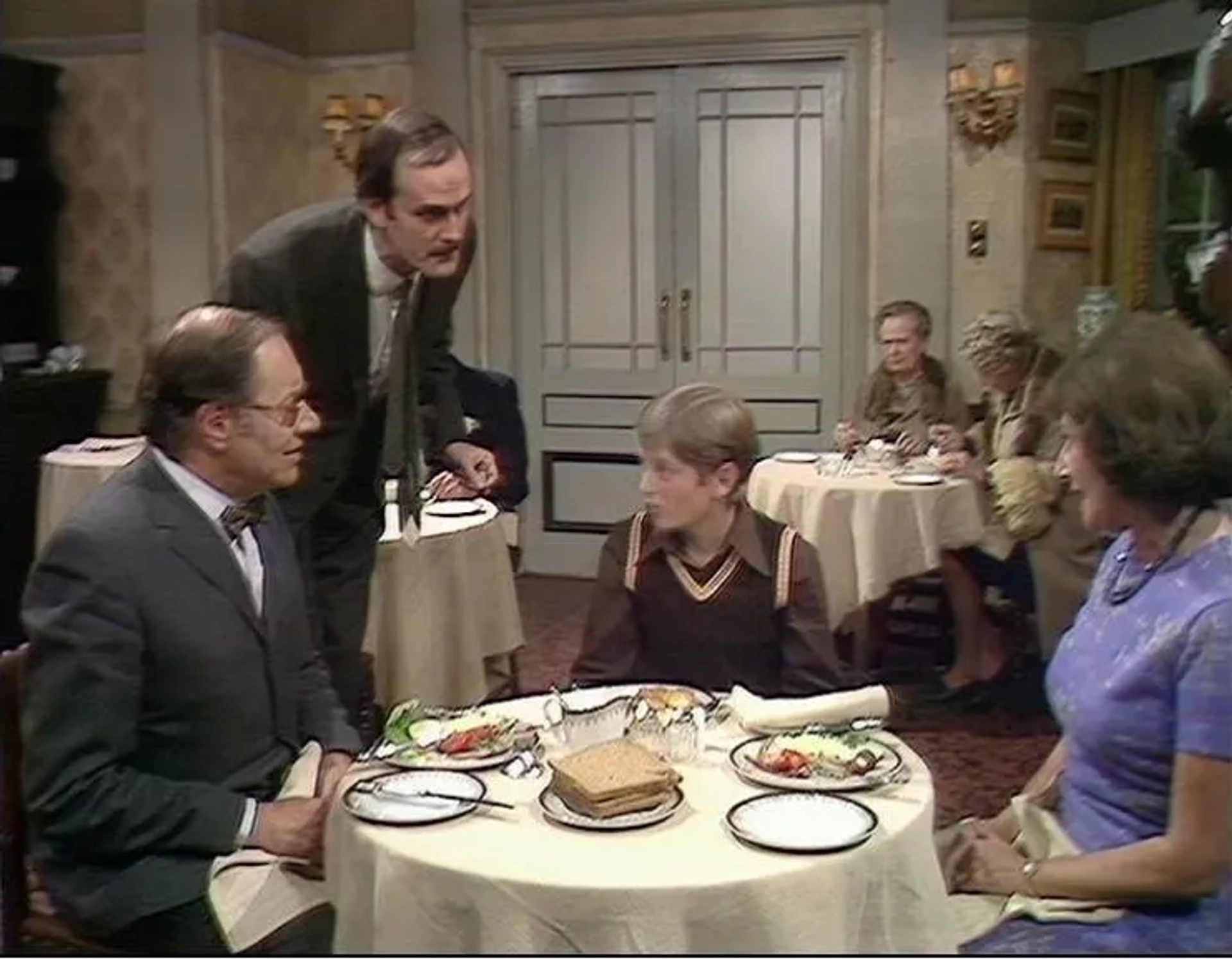 John Cleese, Elizabeth Benson, Gilly Flower, Renee Roberts, Jeffrey Segal, and Tony Page in Fawlty Towers (1975)