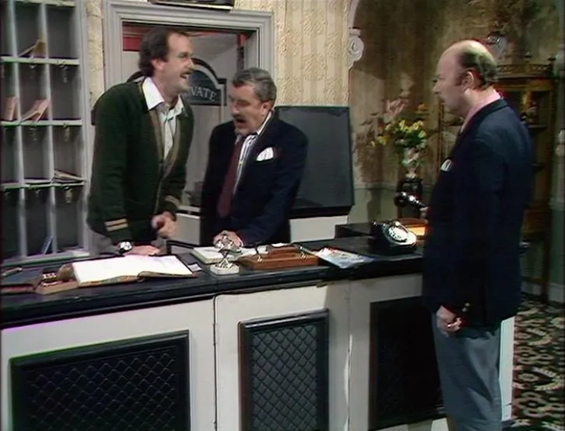 John Cleese, James Cossins, and Bernard Cribbins in Fawlty Towers (1975)