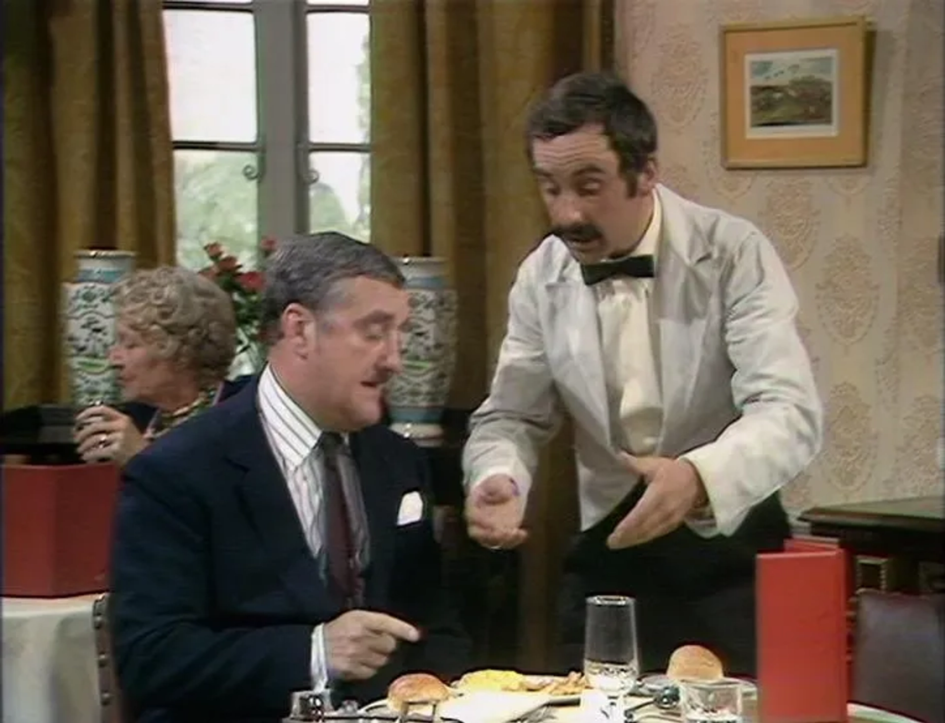 Bernard Cribbins, Gilly Flower, and Andrew Sachs in Fawlty Towers (1975)