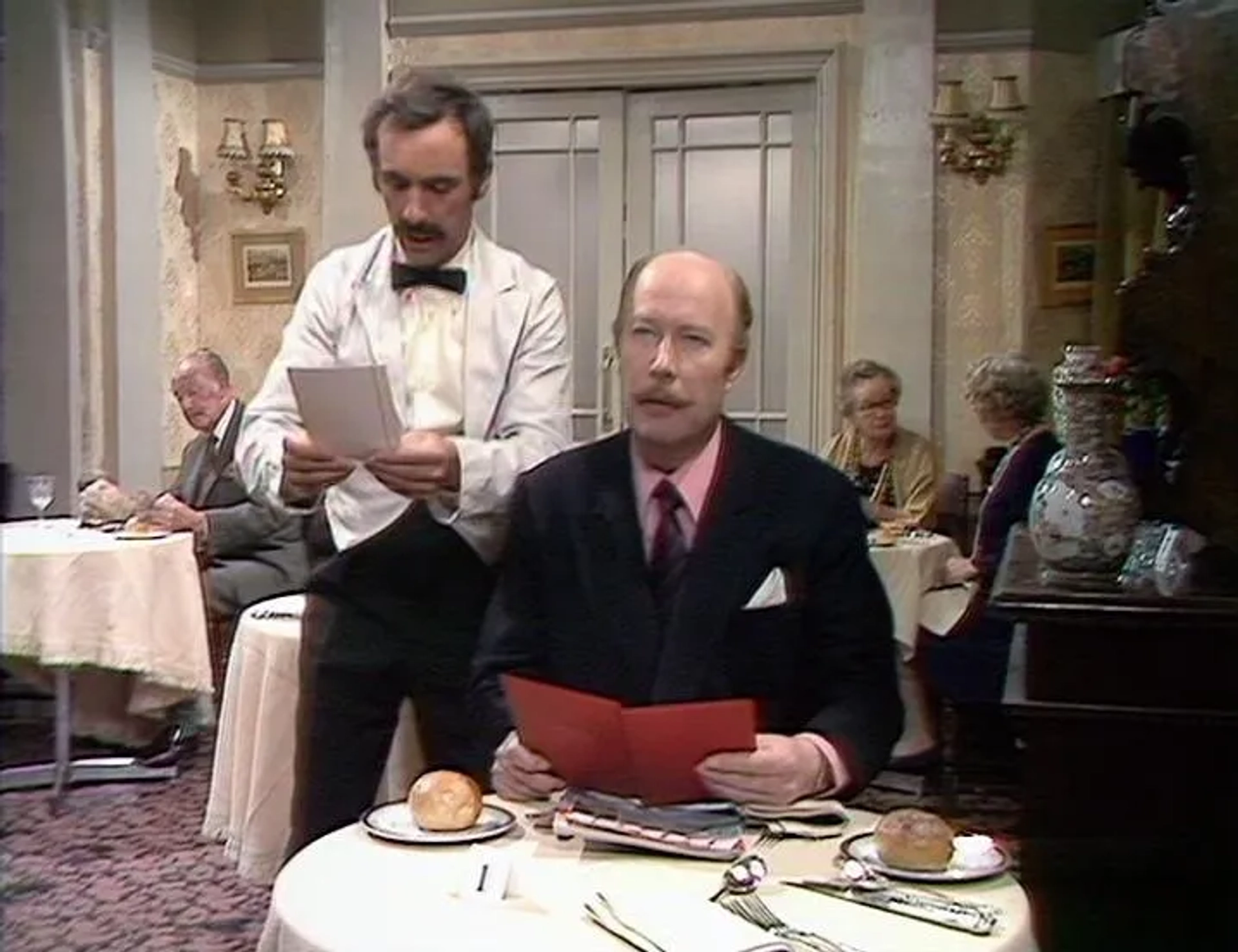 Ballard Berkeley, James Cossins, Renee Roberts, and Andrew Sachs in Fawlty Towers (1975)