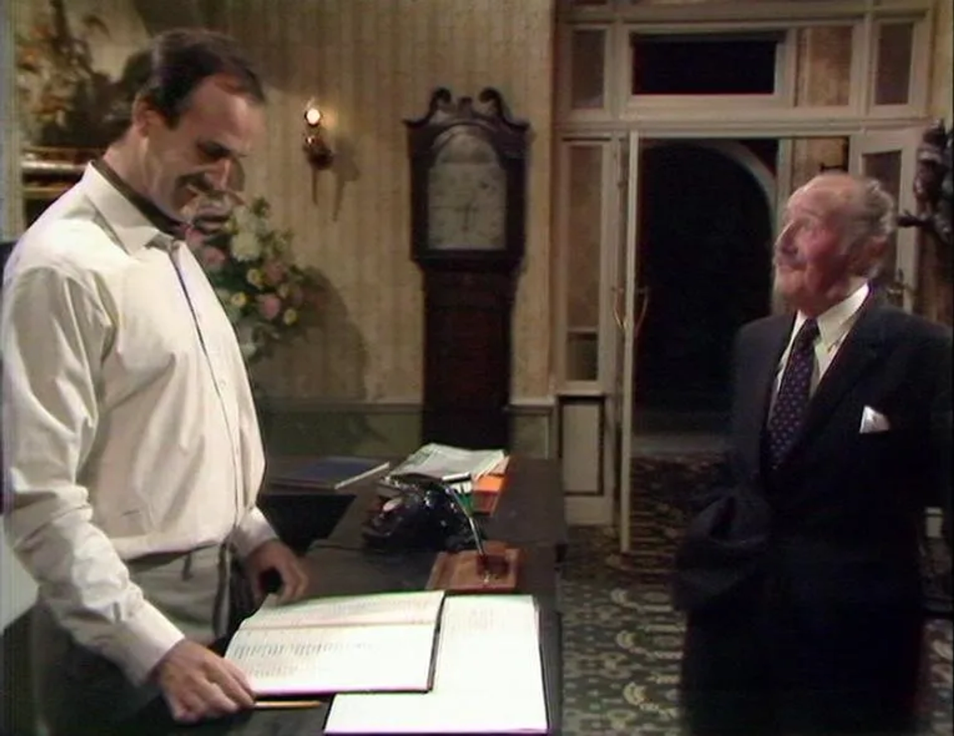 John Cleese and Ballard Berkeley in Fawlty Towers (1975)