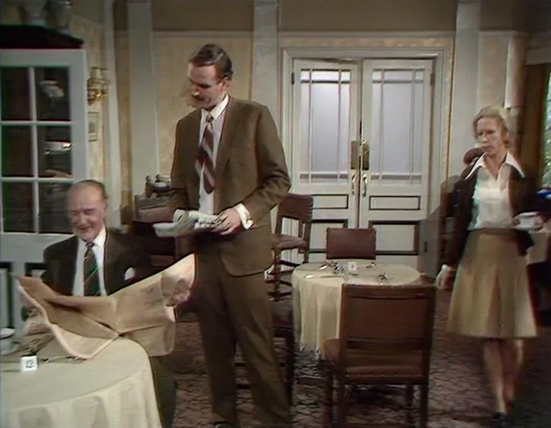 John Cleese, Ballard Berkeley, and Connie Booth in Fawlty Towers (1975)