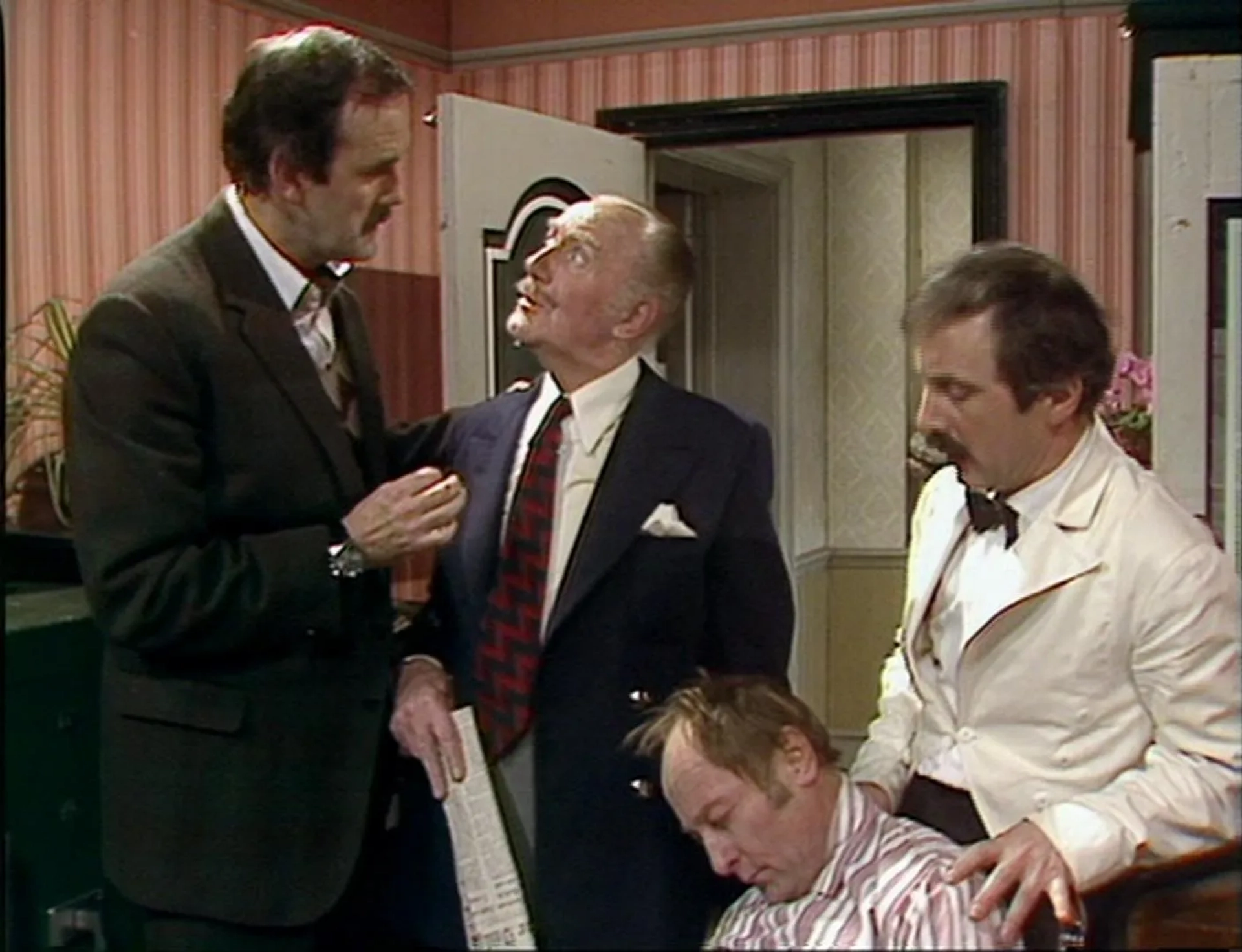 John Cleese, Ballard Berkeley, Derek Royle, and Andrew Sachs in Fawlty Towers (1975)