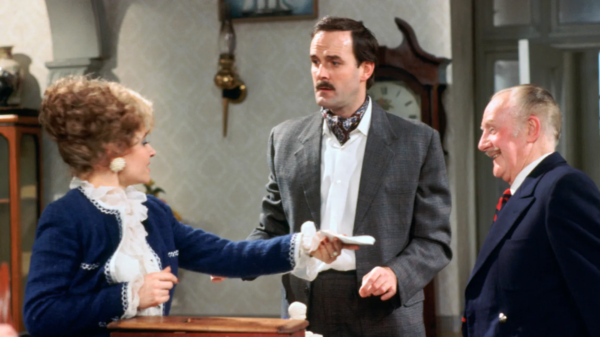 John Cleese, Ballard Berkeley, and Prunella Scales in Fawlty Towers (1975)