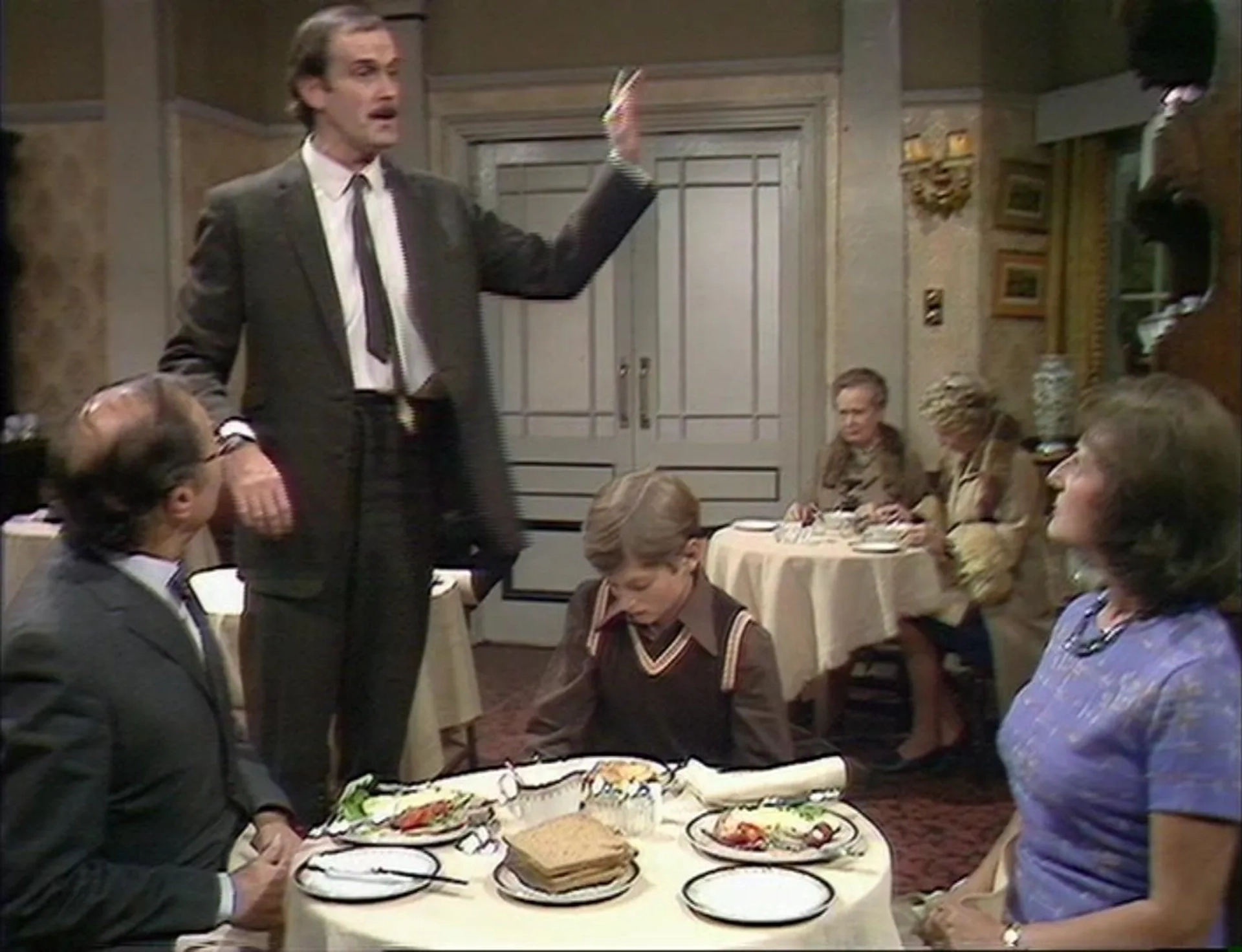 John Cleese, Elizabeth Benson, Gilly Flower, Renee Roberts, Jeffrey Segal, and Tony Page in Fawlty Towers (1975)