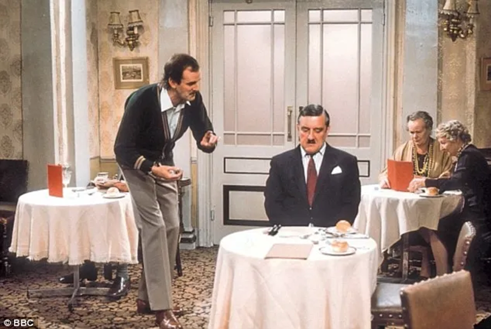 John Cleese, Bernard Cribbins, Gilly Flower, and Renee Roberts in Fawlty Towers (1975)