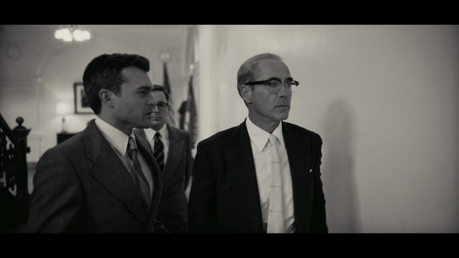 Robert Downey Jr. and Alden Ehrenreich in Oppenheimer (2023)