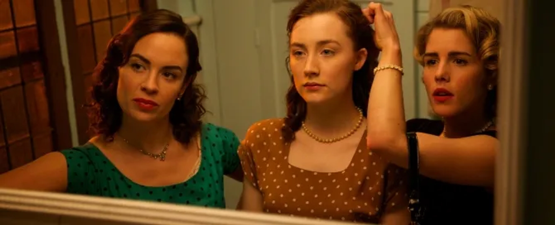 Saoirse Ronan, Eve Macklin, and Emily Bett Rickards in Brooklyn (2015)