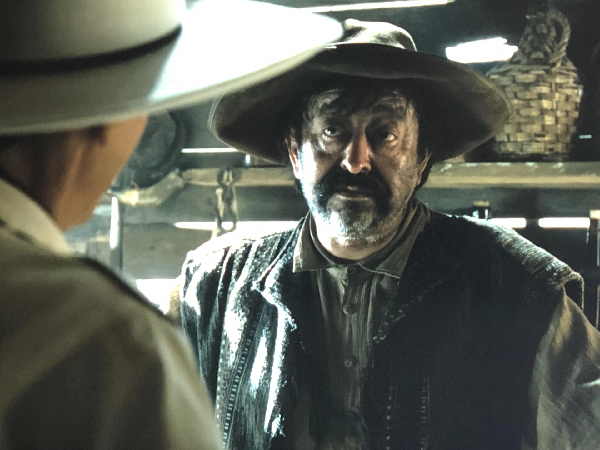 Tim Blake Nelson and Alejandro Patiño in The Ballad of Buster Scruggs (2018)