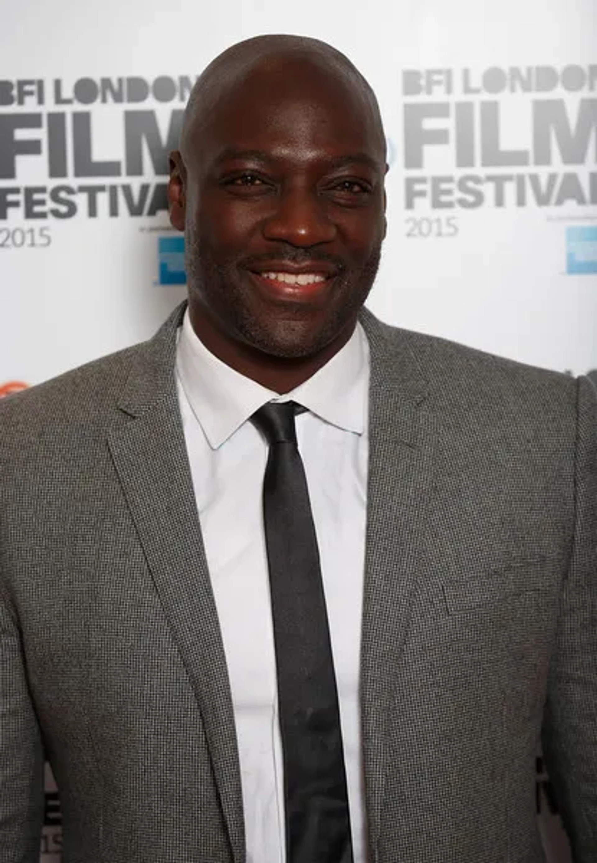 Actors Adewale Akinnuoye-Agbaje attends the "Trumbo" photocall during the BFI London Film Festival at Corinthia Hotel London on October 8, 2015 in London, England.