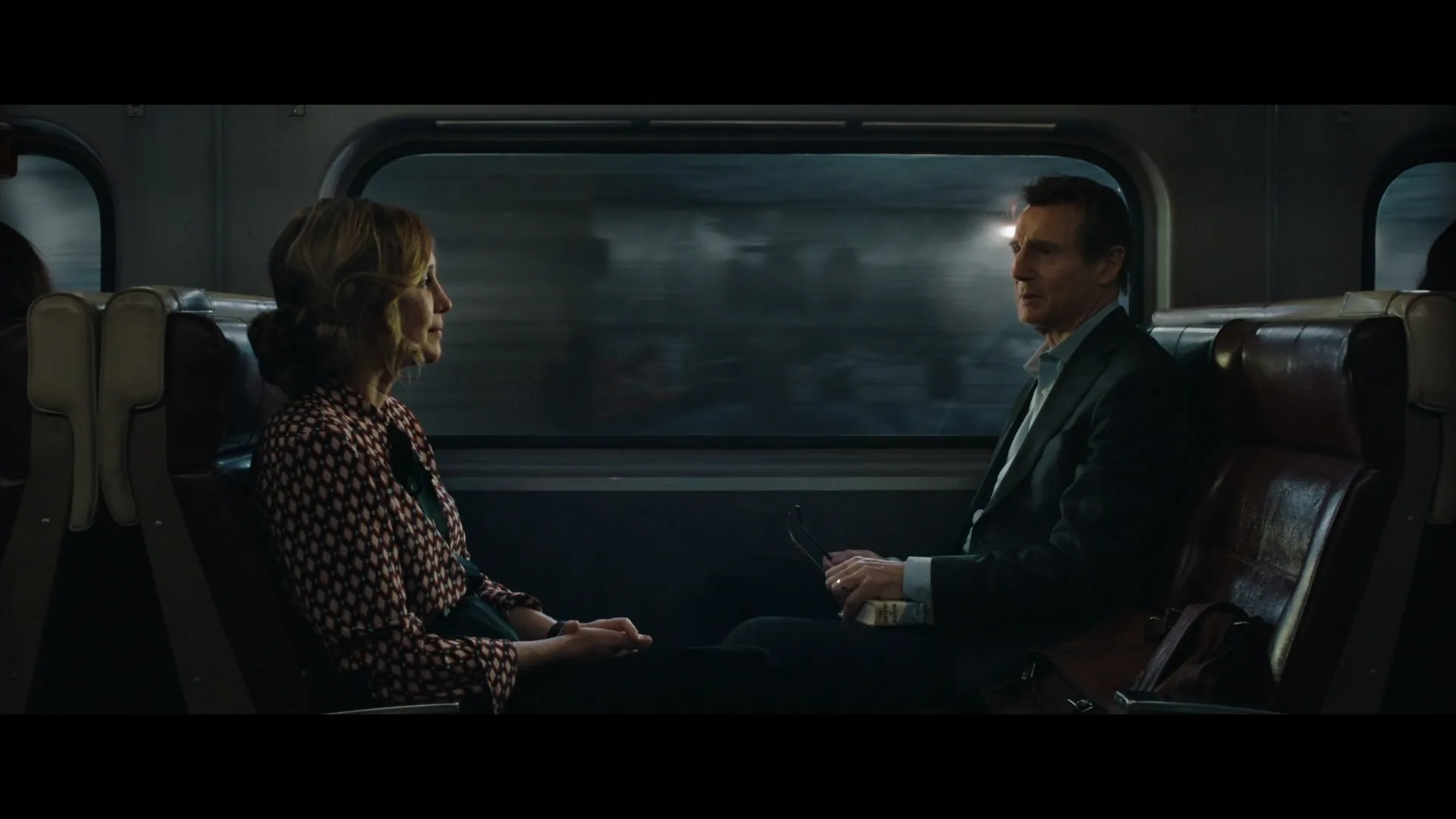 Liam Neeson and Vera Farmiga in The Commuter (2018)