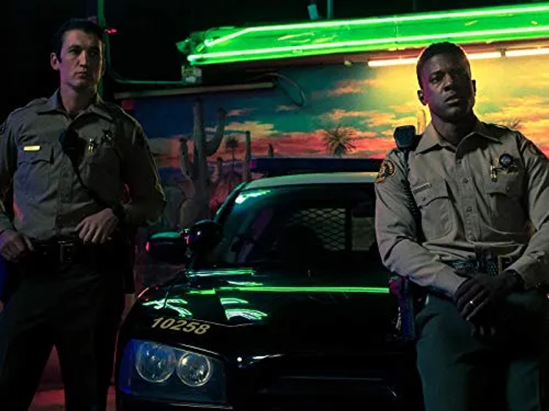 Miles Teller and Lance Gross in Too Old to Die Young (2019)