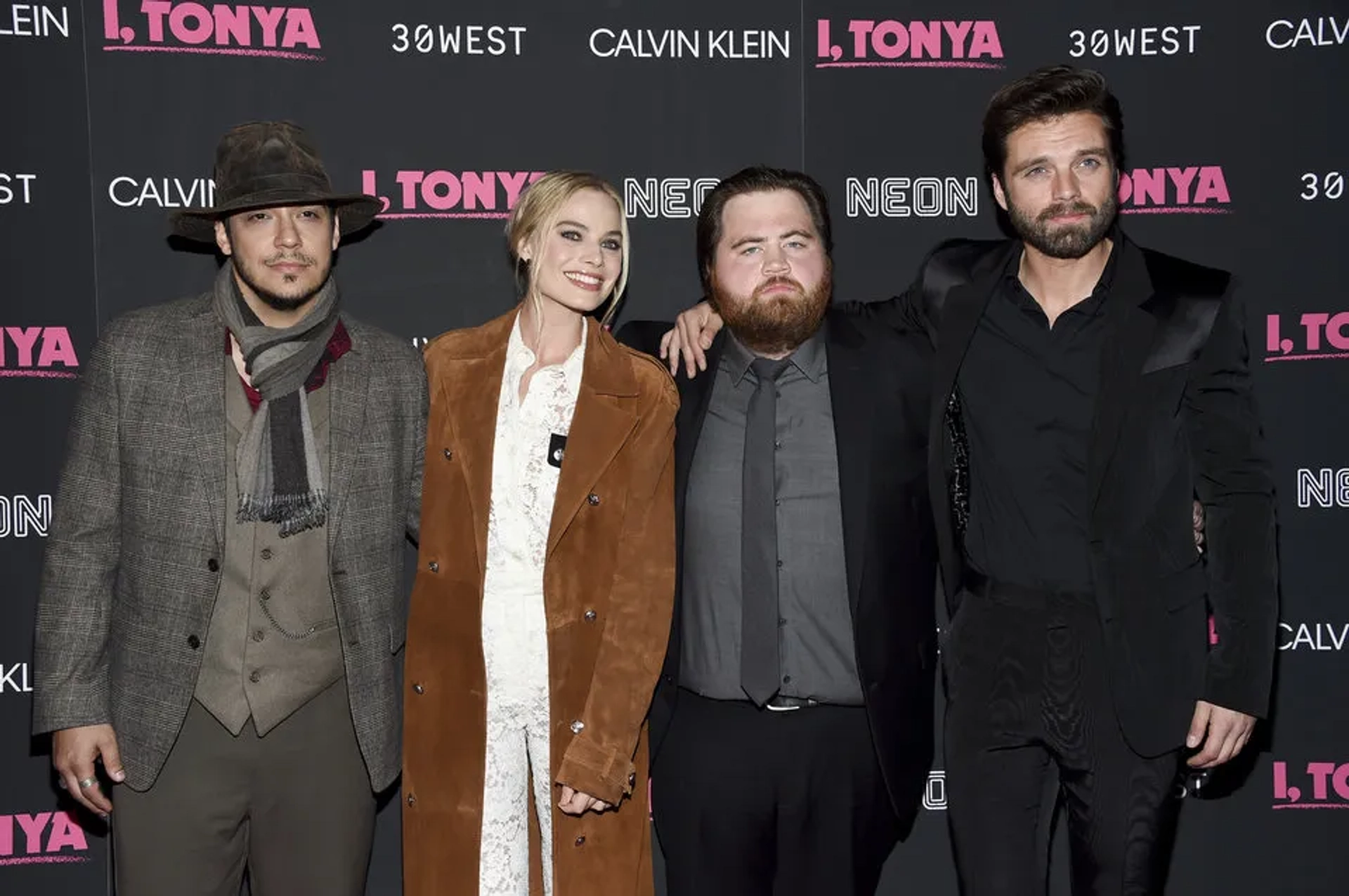 Actors Ricky Russert, from left, Margot Robbie, Paul Walter Hauser and Sebastian Stan pose together at the premiere of "I, Tonya" at Village East Cinema on Tuesday, Nov. 28, 2017, in New York.