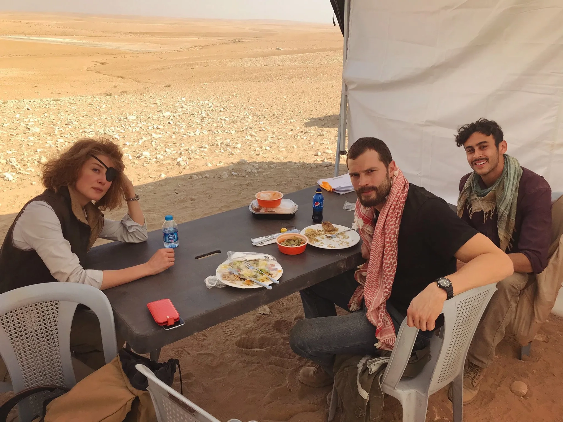 Rosamund Pike, Jamie Dornan, and Fady Elsayed in A Private War (2018)