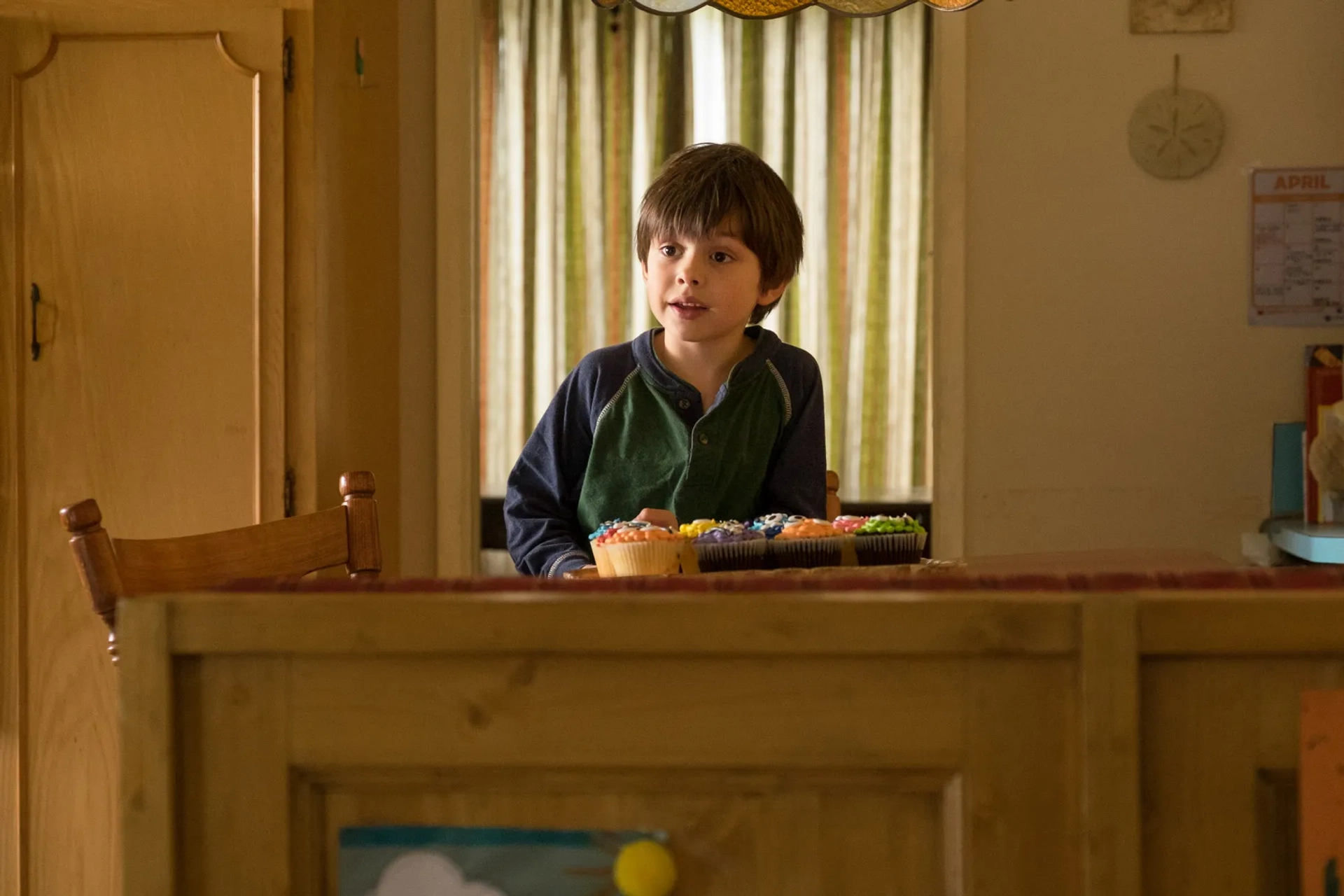 Jonah (Asher Miles Fallica) is excited over cupcakes