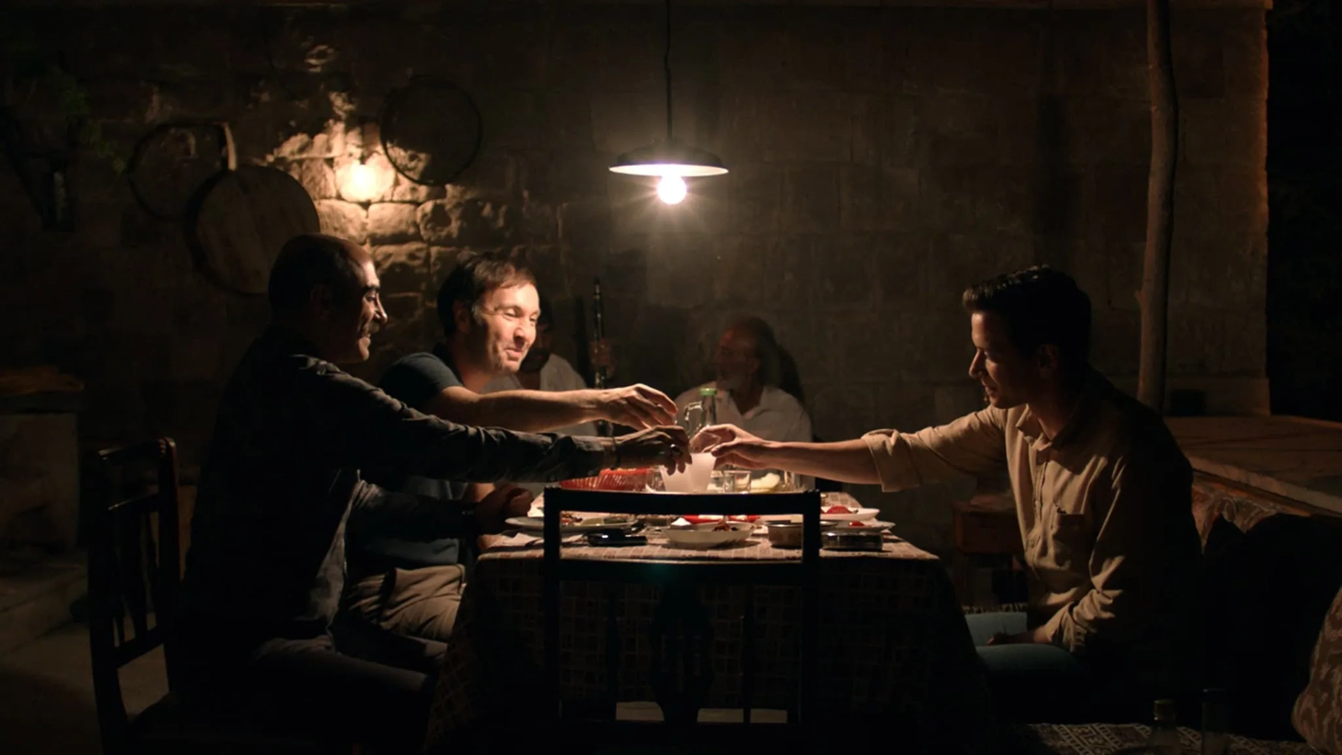 Erol Babaoglu, Selahattin Pasali, and Erdem Senocak in Burning Days (2022)