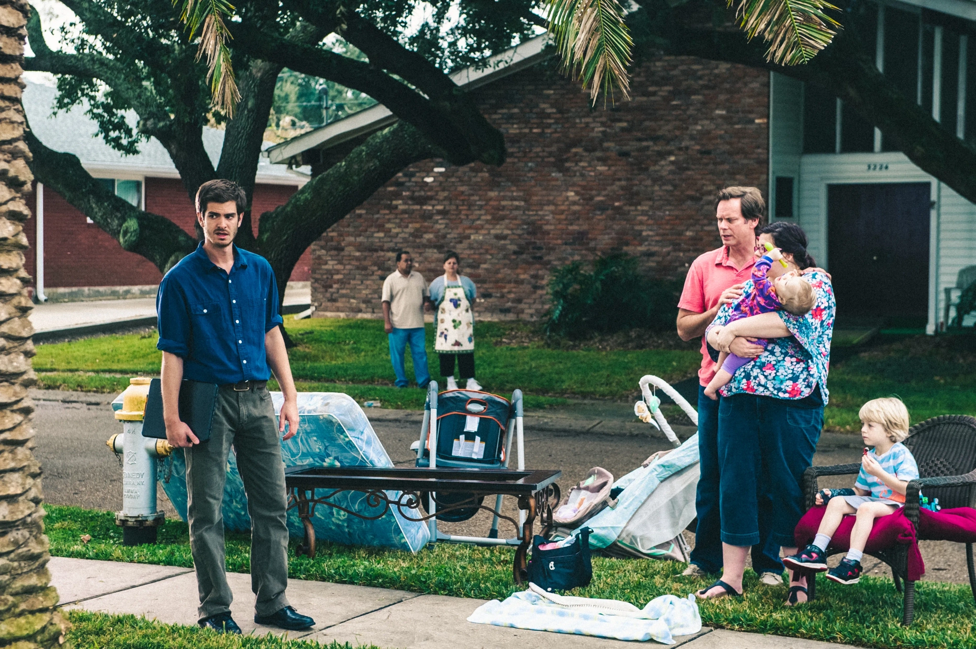 JD Evermore, Ann Mahoney, and Andrew Garfield in 99 Homes (2014)