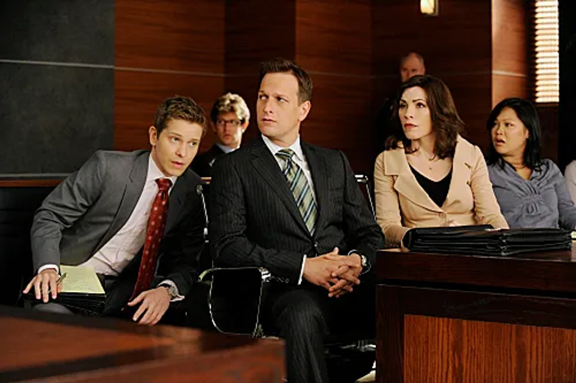 Julianna Margulies, Josh Charles, Matt Czuchry, and Jee Young Han in The Good Wife (2009)