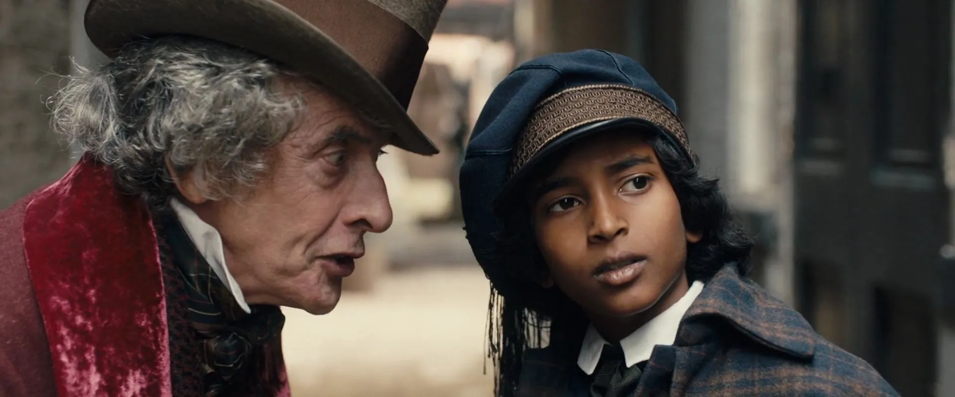 Peter Capaldi and Jairaj Varsani in The Personal History of David Copperfield (2019)