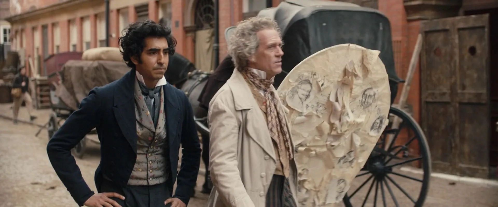 Hugh Laurie and Dev Patel in The Personal History of David Copperfield (2019)