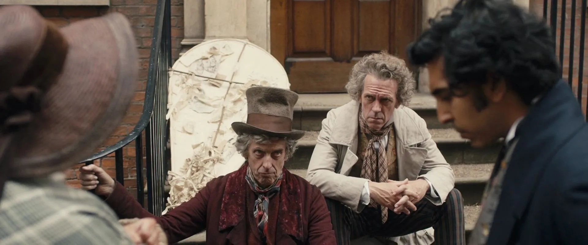 Peter Capaldi, Hugh Laurie, and Dev Patel in The Personal History of David Copperfield (2019)