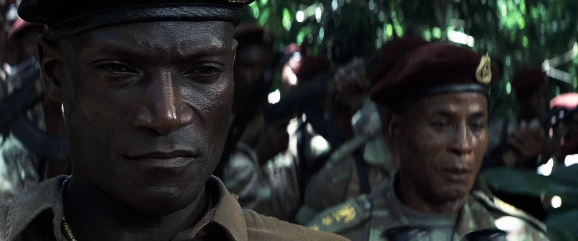 Malick Bowens and Peter Mensah in Tears of the Sun (2003)