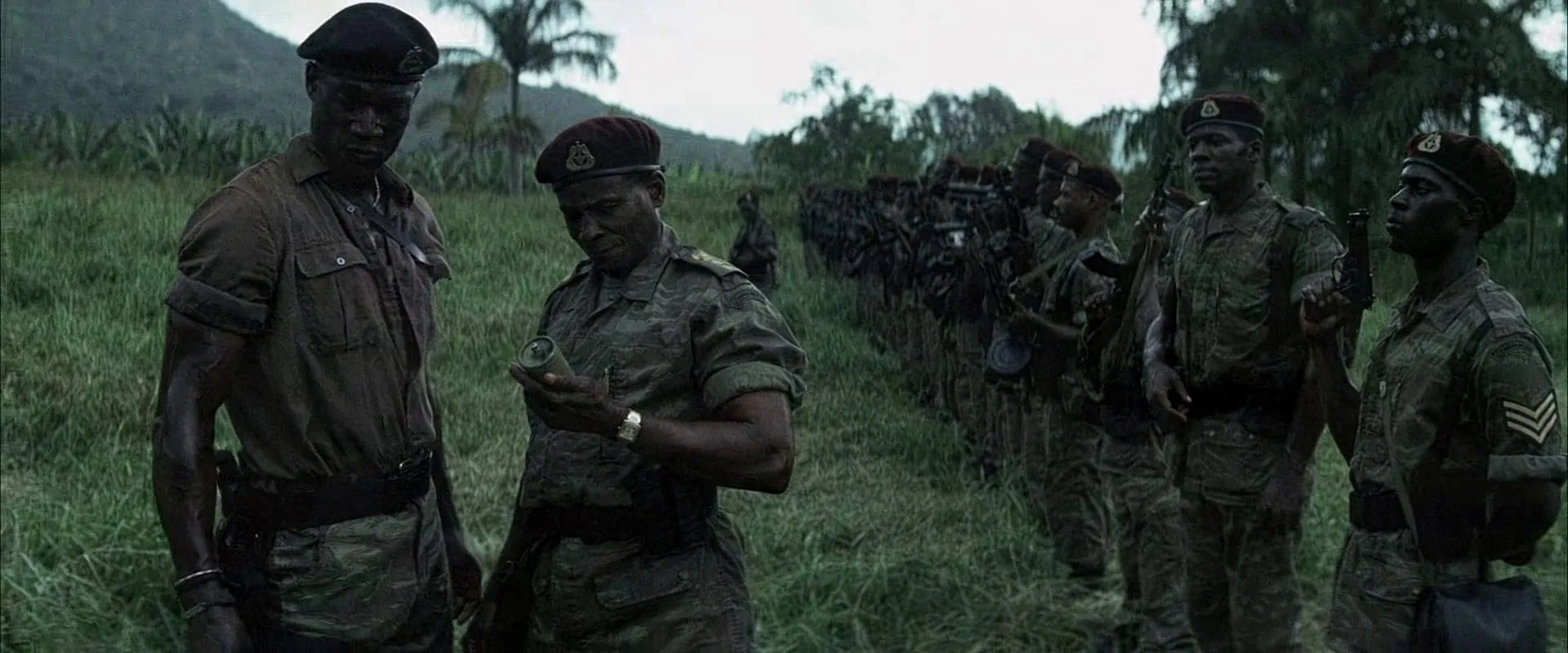 Malick Bowens and Peter Mensah in Tears of the Sun (2003)