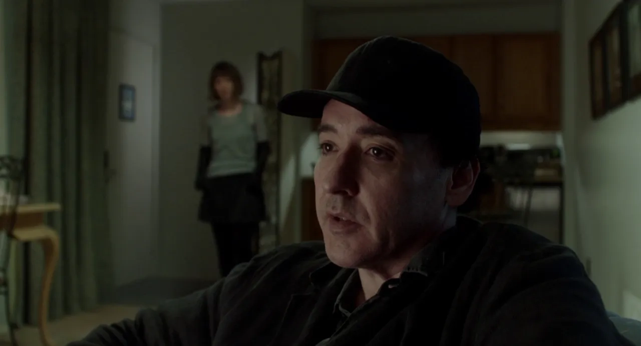 John Cusack and Mia Wasikowska in Maps to the Stars (2014)