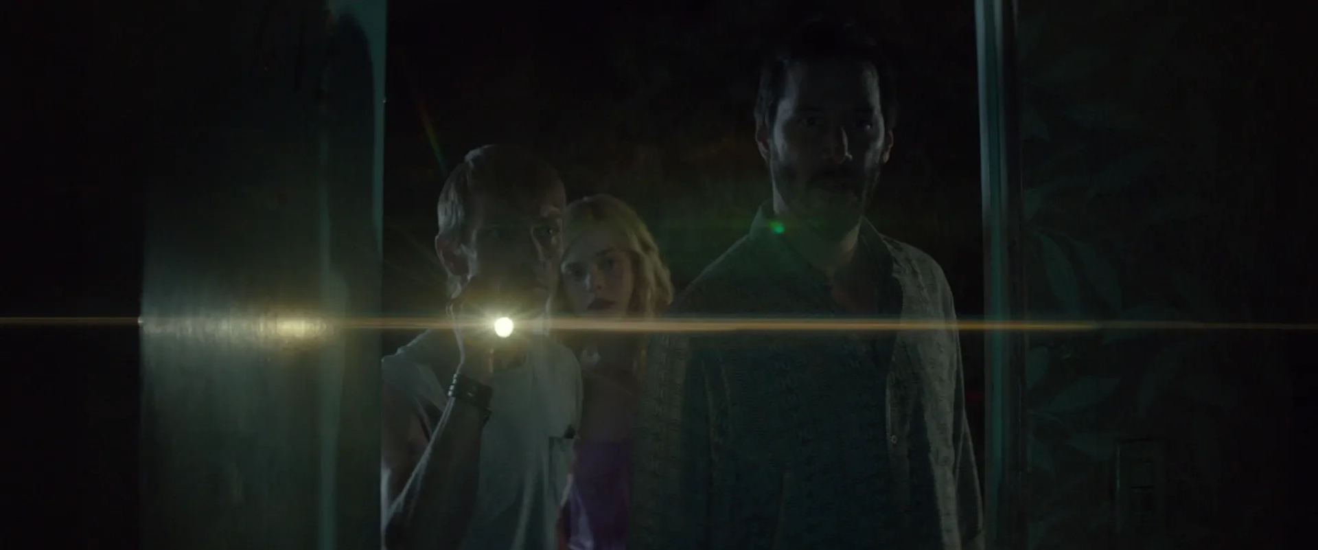 Keanu Reeves, Elle Fanning, and Charles Baker in The Neon Demon (2016)