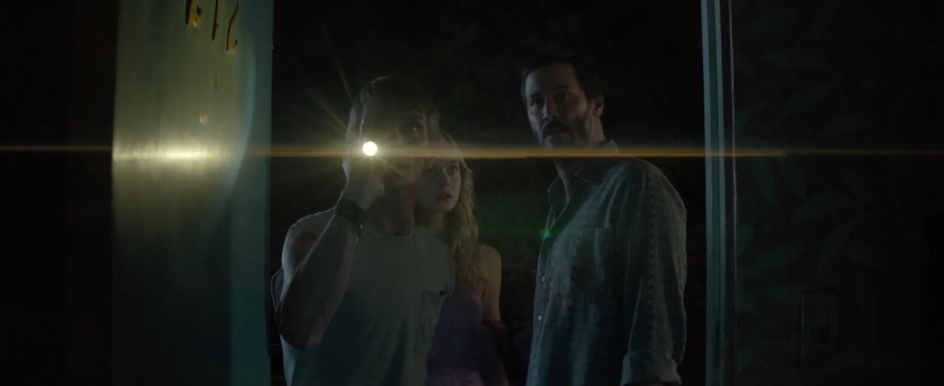 Keanu Reeves, Elle Fanning, and Charles Baker in The Neon Demon (2016)