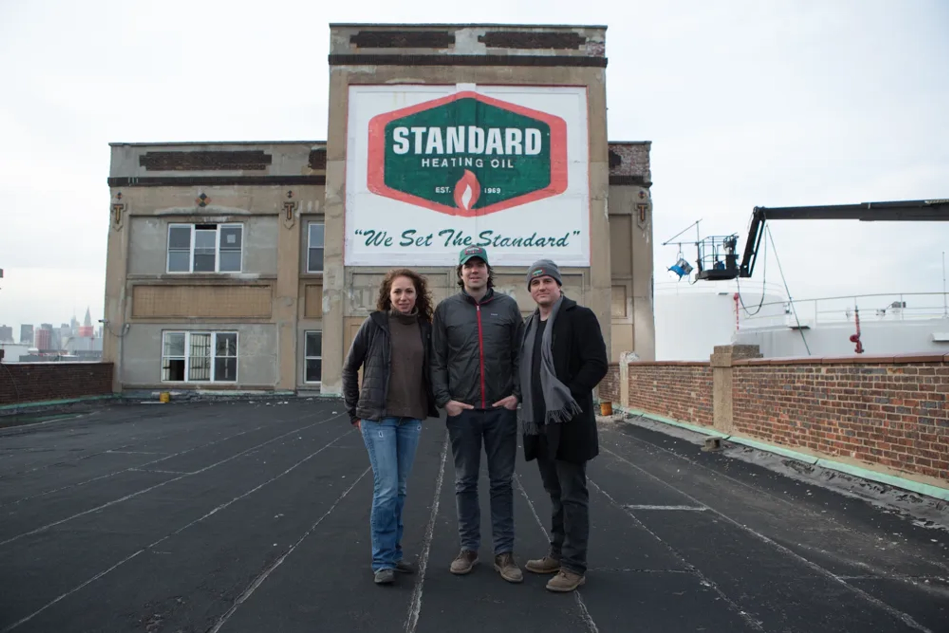 Producer Anna Gerb, director-writer J.C. Chandor, and producer Neal Dodson on the Standard Heating Oil set of "A MOST VIOLENT YEAR".