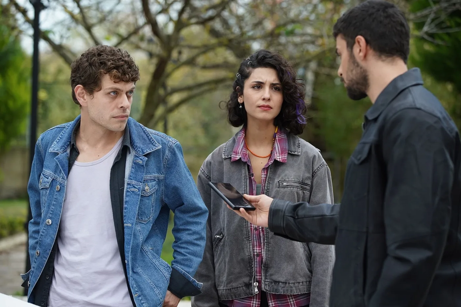 Halit Özgür Sari, Rojbin Erden, and Sezer Aricay in Wild Heart (2023)