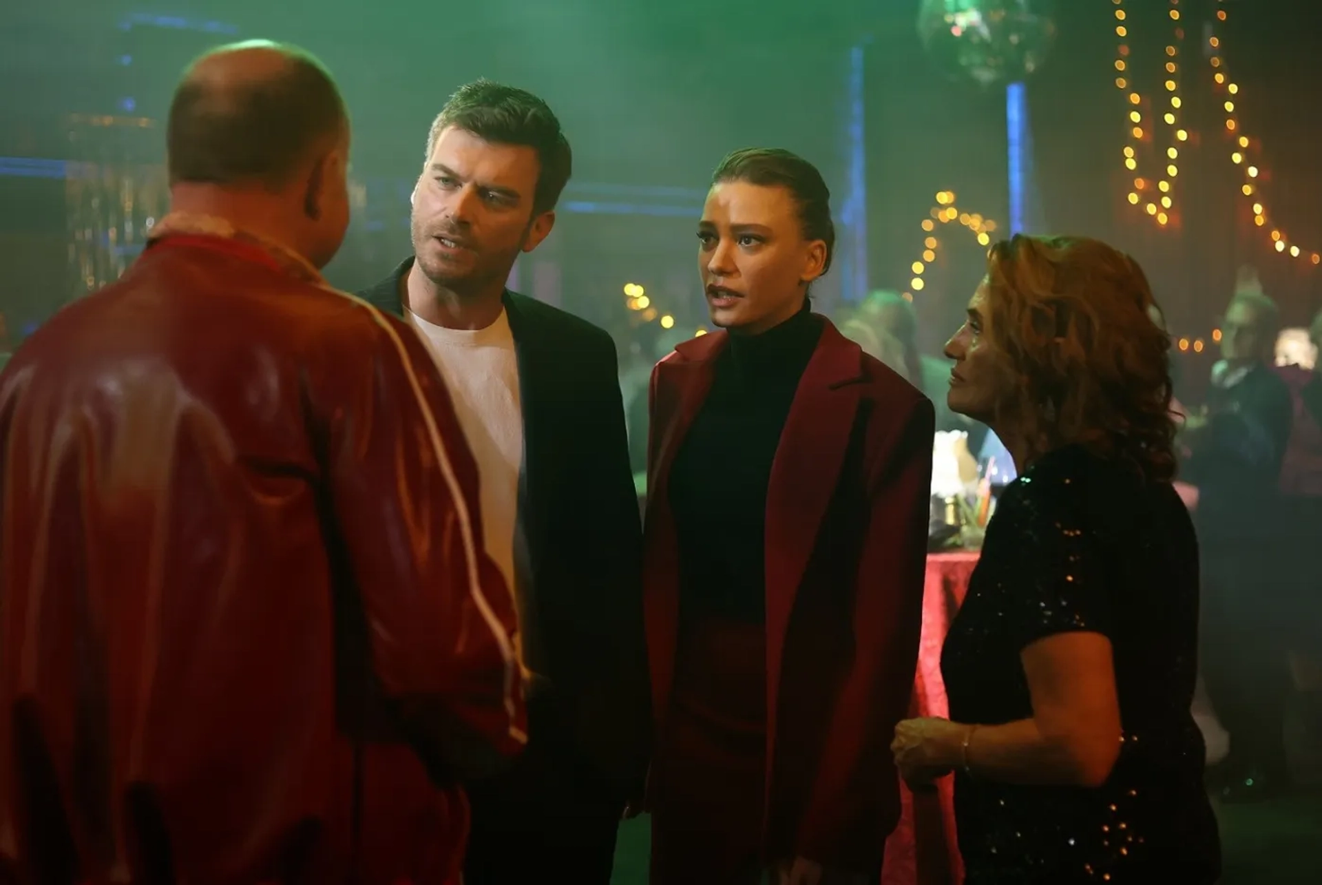 Nur Sürer, Kivanç Tatlitug, and Serenay Sarikaya in The Family (2023)