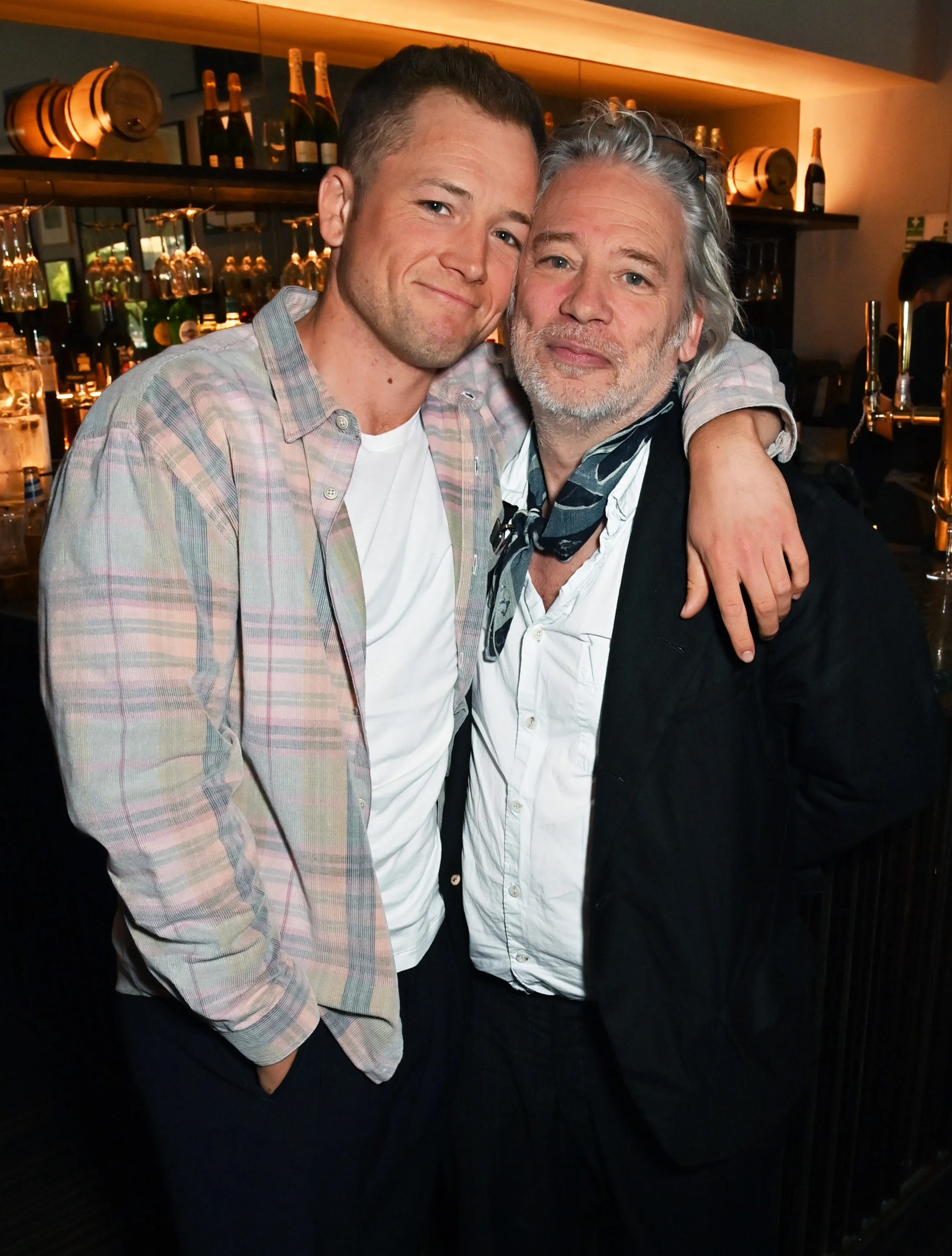 Dexter Fletcher and Taron Egerton at an event for Ghosted (2023)