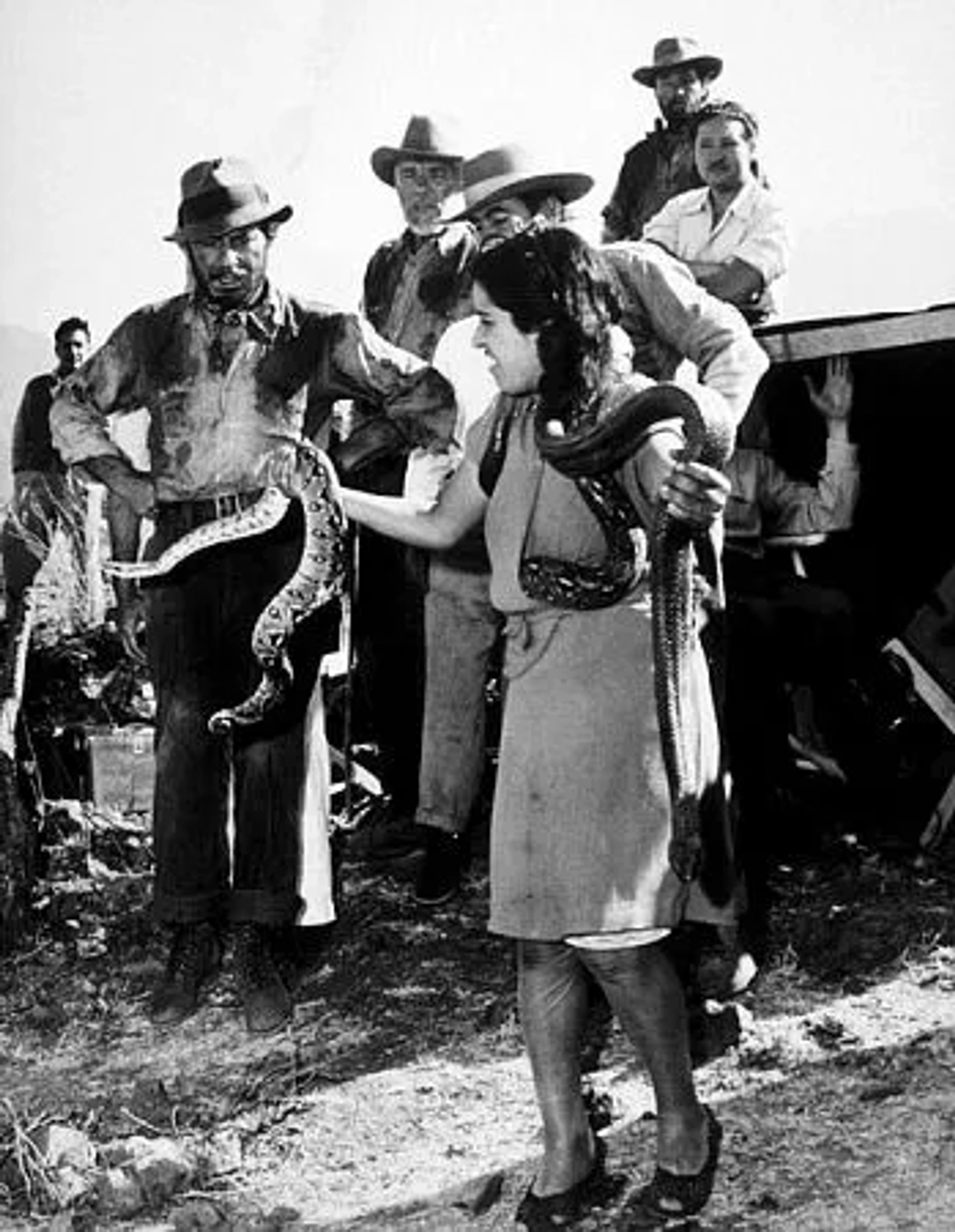 Humphrey Bogart and a rattlesnake handler on the set of "Treaure of the Sierra Madre," 1948 Warner. Bros.