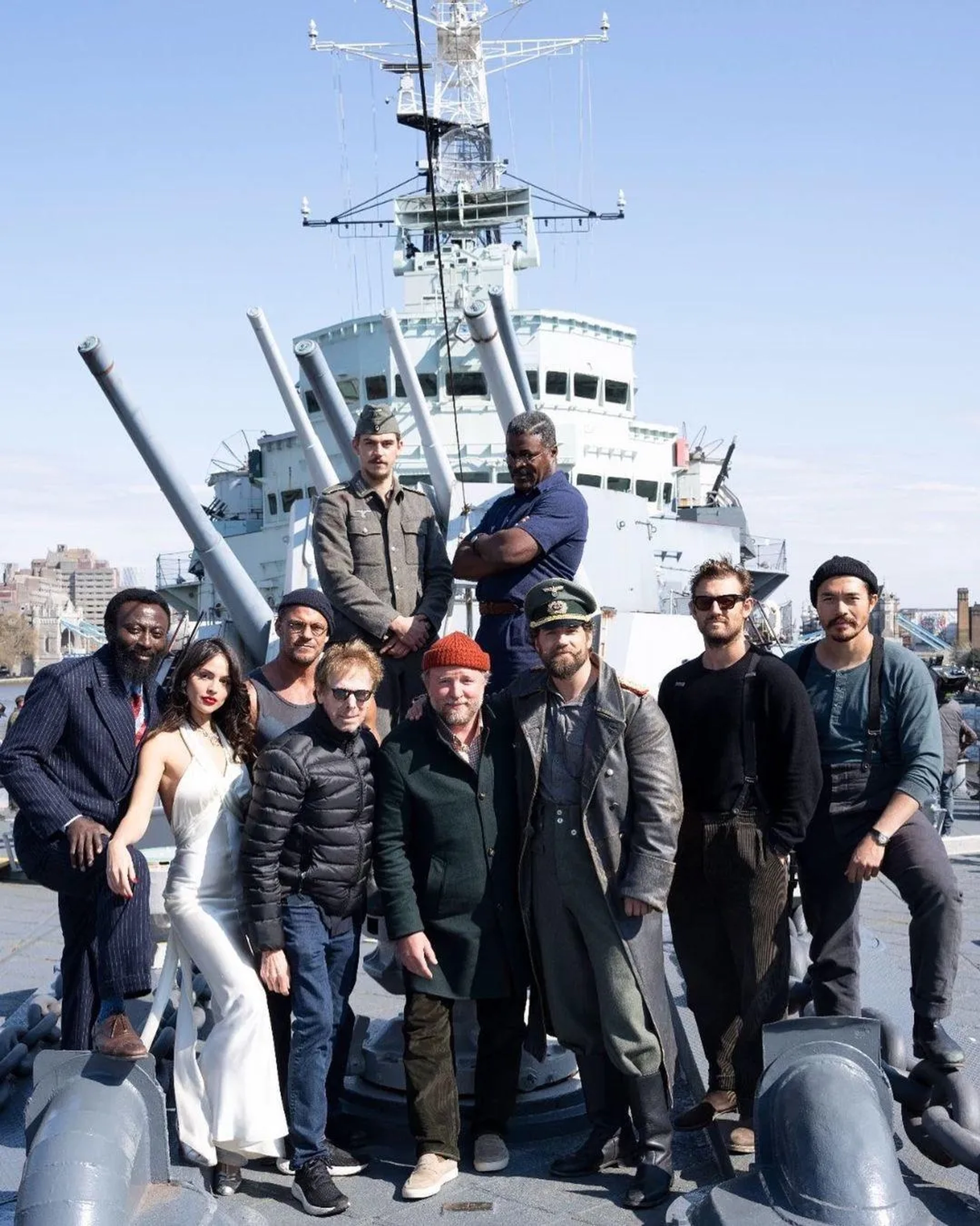 Jerry Bruckheimer, Guy Ritchie, Henry Cavill, Danny Sapani, Alan Ritchson, Babs Olusanmokun, Eiza González, Hero Fiennes Tiffin, and Henry Golding in The Ministry of Ungentlemanly Warfare (2024)