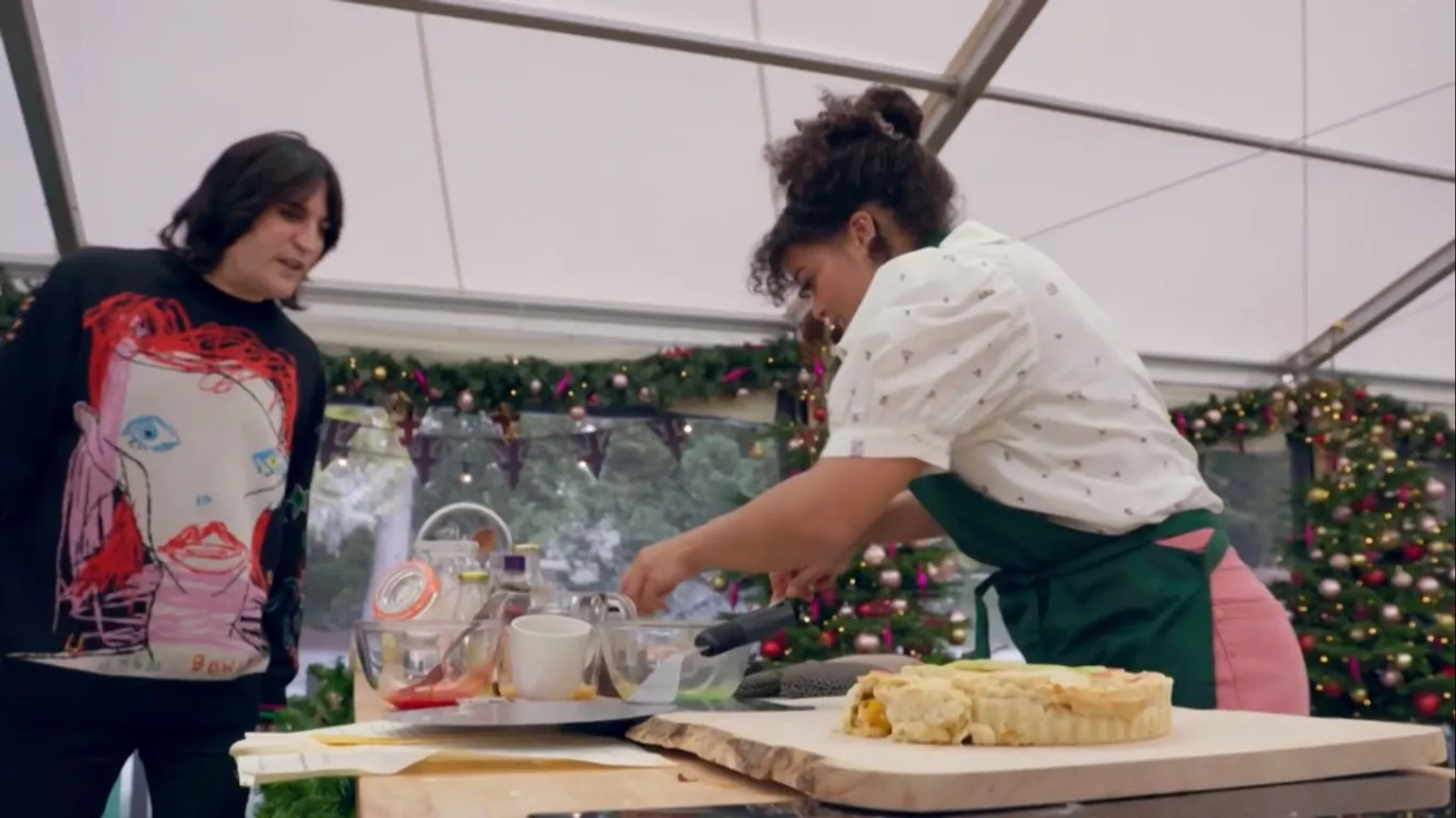 Noel Fielding and Lydia West in The Great British Baking Show: The Great Christmas Bake Off (2021)