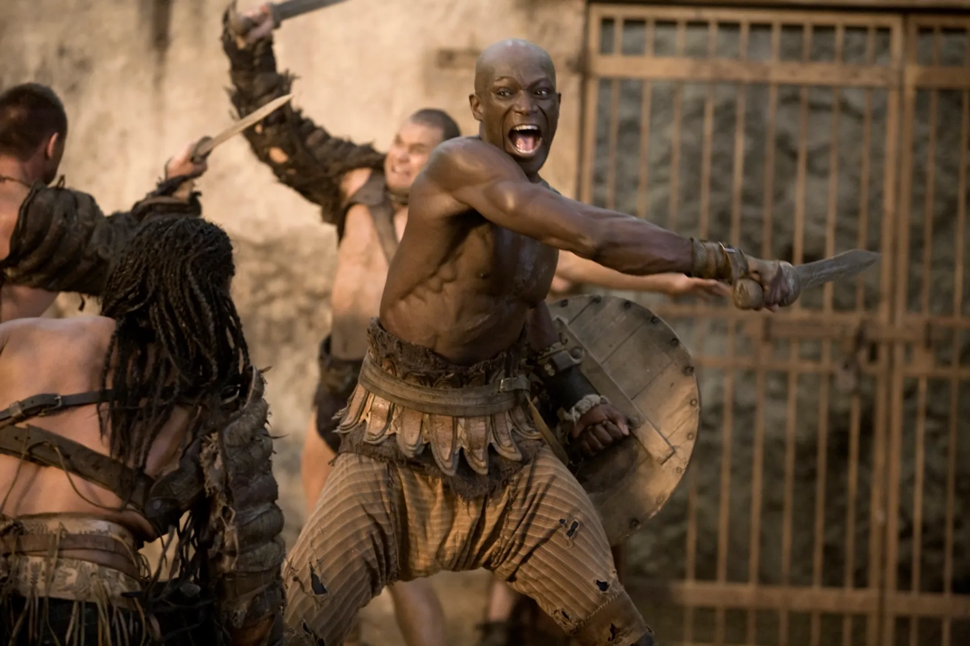 Peter Mensah and Antonio Te Maioha in Spartacus: Gods of the Arena (2011)